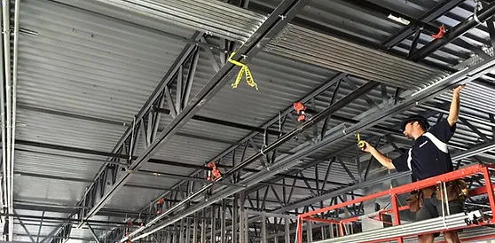 Electrical installation in the ceiling of a commercial retail space.