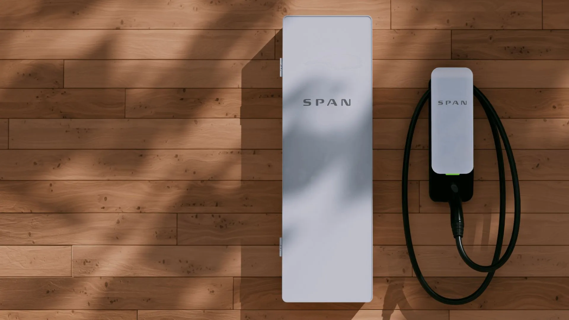 SPAN smart electrical panel and EV charger mounted side by side on a warm wood wall.